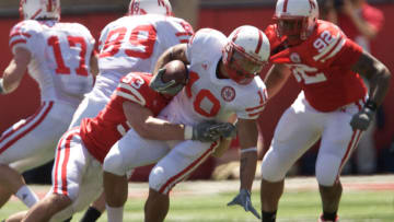Nebraska football running back Roy Helu Jr (10) is tackled by Tyler Wortman (53) in the second quarter during the Red-White spring game. (Bruce Thorson-USA TODAY Sports)
