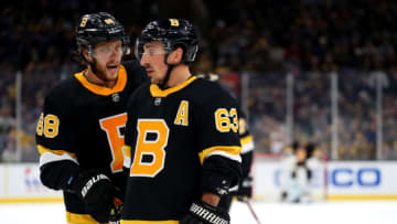 BOSTON, MASSACHUSETTS - NOVEMBER 29: David Pastrnak #88 of the Boston Bruins and Brad Marchand #63 talk during the third period against the New York Rangers at TD Garden on November 29, 2019 in Boston, Massachusetts. (Photo by Maddie Meyer/Getty Images)