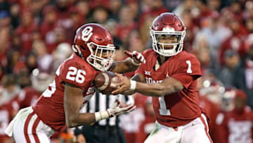 NORMAN, OK - NOVEMBER 10: Quarterback Kyler Murray #1 hands off to running back Kennedy Brooks #26 of the Oklahoma Sooners at Gaylord Family Oklahoma Memorial Stadium on November 10, 2018 in Norman, Oklahoma. Oklahoma defeated Oklahoma State 48-47. (Photo by Brett Deering/Getty Images)