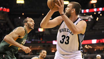 Jan 8, 2017; Memphis, TN, USA; Memphis Grizzlies center Marc Gasol (33) handles the ball against Utah Jazz center Rudy Gobert (27) during the second half at FedExForum. Memphis Grizzlies defeats the Utah Jazz 88-79. Mandatory Credit: Justin Ford-USA TODAY Sports