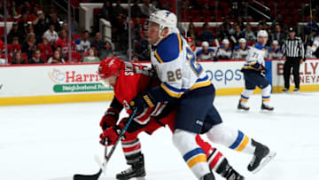 RALEIGH, NC - OCTOBER 27: Jeff Skinner #53 of the Carolina Hurricanes has his stick lifted as he is muscled away from the puck by Paul Stastny #26 of the St. Louis Blues during an NHL game on October 27, 2017 at PNC Arena in Raleigh, North Carolina. (Photo by Gregg Forwerck/NHLI via Getty Images)