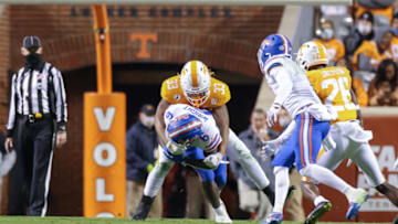 Dec 5, 2020; Knoxville, Tennessee, USA; Tennessee Volunteers linebacker Jeremy Banks (33) tackles Florida Gators running back Nay'Quan Wright (6) during the second half at Neyland Stadium. Mandatory Credit: Randy Sartin-USA TODAY Sports