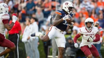 Auburn football tight end Rivaldo Fairweather (13) catches a pass over the middle as Auburn Tigers take on New Mexico State Aggies at Jordan-Hare Stadium in Auburn, Ala., on Saturday, Nov. 18, 2023. New Mexico State Aggies leads Auburn Tigers 10-7 at halftime.