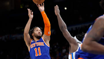 Nov 21, 2022; Oklahoma City, Oklahoma, USA; New York Knicks guard Jalen Brunson (11) shoots as Oklahoma City Thunder forward Luguentz Dort (5) defends the shot during the second quarter at Paycom Center. Mandatory Credit: Alonzo Adams-USA TODAY Sports
