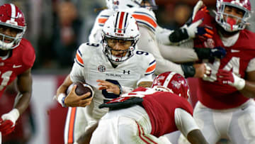 Auburn footballNov 26, 2022; Tuscaloosa, Alabama, USA; Auburn Tigers quarterback Robby Ashford (9) carries the ball against the Alabama Crimson Tide during the second half at Bryant-Denny Stadium. Mandatory Credit: Marvin Gentry-USA TODAY Sports