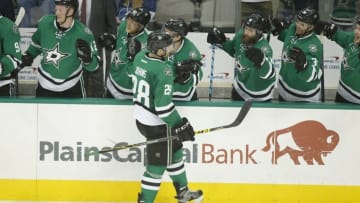 Mar 17, 2016; Dallas, TX, USA; Dallas Stars defenseman Stephen Johns (28) is congratulated by his teammates after scoring his first career goal in the third period against the Tampa Bay Lightning at American Airlines Center. The Stars won 4-3. Mandatory Credit: Tim Heitman-USA TODAY Sports