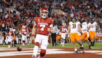 Oklahoma's Spencer Rattler (7) scores a touchdown during a Bedlam college football game between the University of Oklahoma Sooners (OU) and the Oklahoma State Cowboys (OSU) at Gaylord Family-Oklahoma Memorial Stadium in Norman, Okla., Saturday, Nov. 21, 2020. Oklahoma won 41-13. [Bryan Terry/The Oklahoman]Photo 7