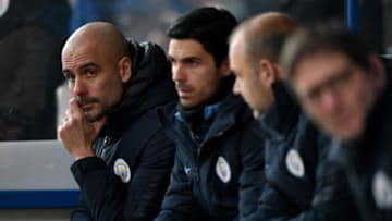 HUDDERSFIELD, ENGLAND - JANUARY 20: Manchester City manager Josep Guardiola with his backroom staff Mikel Arteta, Rodolfo Borrell and Carles Planchart during the Premier League match between Huddersfield Town and Manchester City at John Smith's Stadium on January 20, 2019 in Huddersfield, United Kingdom. (Photo by Gareth Copley/Getty Images)