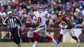 LANDOVER, MD - DECEMBER 22: Daniel Jones #8 of the New York Giants looks scrambles as Jon Bostic #53 of the Washington Redskins defends during the second half at FedExField on December 22, 2019 in Landover, Maryland. (Photo by Scott Taetsch/Getty Images)