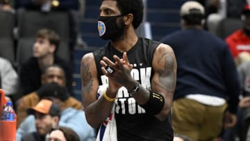 Kyrie Irving #11 of the Brooklyn Nets cheers on his team in the first quarter against the Washington Wizards(Photo by Greg Fiume/Getty Images)