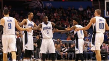 Jan 25, 2015; Orlando, FL, USA; Orlando Magic guard Victor Oladipo (5) high fives forward Channing Frye (8) and center Nikola Vucevic (9) and guard Elfrid Payton (4) and forward Aaron Gordon (00) against the Indiana Pacers during the first quarter at Amway Center. Mandatory Credit: Kim Klement-USA TODAY Sports
