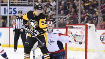 PITTSBURGH, PA - FEBRUARY 02: Pittsburgh Penguins Left Wing Jake Guentzel (59) attempts to deflects the puck past Washington Capitals Goalie Braden Holtby (70) during the second period in the NHL game between the Pittsburgh Penguins and the Washington Capitals on February 2, 2018, at PPG Paints Arena in Pittsburgh, PA. (Photo by Jeanine Leech/Icon Sportswire via Getty Images)
