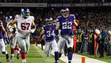 Dec 27, 2015; Minneapolis, MN, USA; Minnesota Vikings safety Harrison Smith (22) returns an interception for a touchdown during the second quarter against the New York Giants at TCF Bank Stadium. Mandatory Credit: Brace Hemmelgarn-USA TODAY Sports