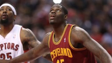 Feb 21, 2014; Toronto, Ontario, CAN; Cleveland Cavaliers forward Anthony Bennett (15) watches a free throw next to Toronto Raptors forward John Salmons (25) at Air Canada Centre. The Raptors beat the Cavaliers 98-91. Mandatory Credit: Tom Szczerbowski-USA TODAY Sports