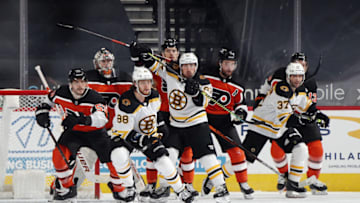 PHILADELPHIA, PENNSYLVANIA - FEBRUARY 03: David Pastrnak #88, Brad Marchand #63 and Patrice Bergeron #37 of the Boston Bruins skate against the Philadelphia Flyers at Wells Fargo Center on February 03, 2021 in Philadelphia, Pennsylvania. (Photo by Bruce Bennett/Getty Images)