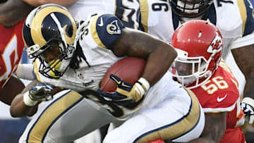 Aug 20, 2016; Los Angeles, CA, USA; Los Angeles Rams running back Todd Gurley (30) runs the ball as Kansas City Chiefs linebacker Derrick Johnson (56) attempts to tackle at Los Angeles Memorial Coliseum. Mandatory Credit: Richard Mackson-USA TODAY Sports