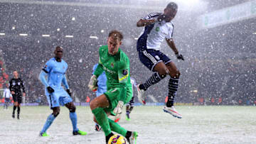 WEST BROMWICH, ENGLAND - DECEMBER 26: Joe Hart of Manchester City retrieves the ball under pressure from Brown Ideye of West Brom during the Barclays Premier League match between West Bromwich Albion and Manchester City at The Hawthorns on December 26, 2014 in West Bromwich, England. (Photo by Scott Heavey/Getty Images)