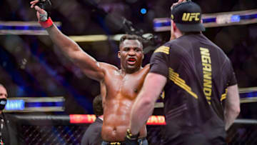 Jan 22, 2022; Anaheim, California, USA; Francis Ngannou (red gloves) celebrates after the fight against Ciryl Gane (blue gloves) during UFC 270 at Honda Center. Mandatory Credit: Gary A. Vasquez-USA TODAY Sports
