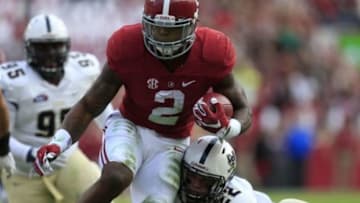 Nov 21, 2015; Tuscaloosa, AL, USA; Alabama Crimson Tide running back Derrick Henry (2) is hit by Charleston Southern Buccaneers linebacker Zack Johnson (22) as he goes for a score at Bryant-Denny Stadium. Mandatory Credit: Marvin Gentry-USA TODAY Sports