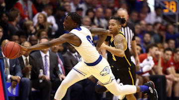 LAWRENCE, KANSAS - DECEMBER 10: Marcus Garrett #0 of the Kansas Jayhawks steals the ball from Te'Jon Lucas #3 of the Milwaukee Panthers during the game at Allen Fieldhouse on December 10, 2019 in Lawrence, Kansas. (Photo by Jamie Squire/Getty Images)