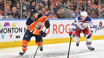 EDMONTON, AB - DECEMBER 31: Kailer Yamamoto #56 of the Edmonton Oilers skates with the puck while being pursued by Brady Skjei #76 of the New York Rangers on December 31, 2019, at Rogers Place in Edmonton, Alberta, Canada. (Photo by Andy Devlin/NHLI via Getty Images)