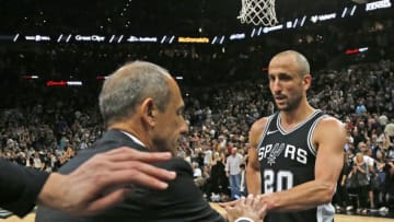 SAN ANTONIO,TX - APRIL 22: Assistant coach Ettore Messinaof the San Antonio Spurs, filling in for head coach Gregg Popovich who is away after the death of his wife, congratulates Manu Ginobili