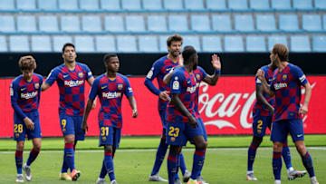 PONTEVEDRA, SPAIN - JUNE 27: (L-R) Riqui Puig of FC Barcelona, Luis Suarez of FC Barcelona, Ansu Fati of FC Barcelona, Gerard Pique of FC Barcelona, Samuel Umtiti of FC Barcelona, Nelson Semedo of FC Barcelona, Ivan Rakitic of FC Barcelona celebrates goal 1-2 during the La Liga Santander match between Celta de Vigo v FC Barcelona at the Estadio de Balaidos on June 27, 2020 in Pontevedra Spain (Photo by David S. Bustamante/Soccrates/Getty Images)