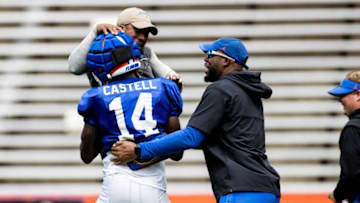 Florida Gators strength coaches celebrate with Florida Gators safety Jordan Castell (14) after a defensive play during fall football practice at Ben Hill Griffin Stadium at the University of Florida in Gainesville, FL on Saturday, August 5, 2023. [Matt Pendleton/Gainesville Sun]