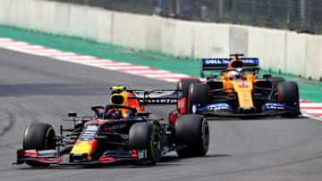 MEXICO CITY, MEXICO - OCTOBER 27: Alexander Albon of Thailand driving the (23) Aston Martin Red Bull Racing RB15 leads Carlos Sainz of Spain driving the (55) McLaren F1 Team MCL34 Renault on track during the F1 Grand Prix of Mexico at Autodromo Hermanos Rodriguez on October 27, 2019 in Mexico City, Mexico. (Photo by Mark Thompson/Getty Images)