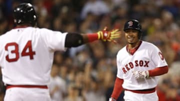May 5, 2015; Boston, MA, USA; Boston Red Sox designated hitter David Ortiz (34) congratulates center fielder Mookie Betts (50) on hitting his second home run of the game during the eighth inning against the Tampa Bay Rays at Fenway Park. Mandatory Credit: Greg M. Cooper-USA TODAY Sports