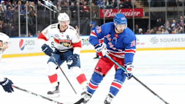 NEW YORK, NY - NOVEMBER 17: Chris Kreider #20 of the New York Rangers skates with the puck against Jonathan Huberdeau #11 of the Florida Panthers at Madison Square Garden on November 17, 2018 in New York City. The New York Rangers won 4-2. (Photo by Jared Silber/NHLI via Getty Images)