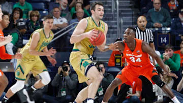 SOUTH BEND, IN - JANUARY 05: John Mooney #33 of the Notre Dame Fighting Irish looks to the basket while defended by Bourama Sidibe #34 of the Syracuse Orange in the second half of the game at Purcell Pavilion on January 5, 2019 in South Bend, Indiana. Syracuse won 72-62. (Photo by Joe Robbins/Getty Images)
