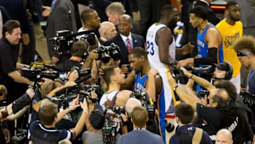 May 30, 2016; Oakland, CA, USA; Golden State Warriors guard Stephen Curry (30) and Oklahoma City Thunder forward Kevin Durant (35) meet after game seven of the Western conference finals of the NBA Playoffs at Oracle Arena. The Golden State Warriors defeated the Oklahoma City Thunder 96-88. Mandatory Credit: Kelley L Cox-USA TODAY Sports