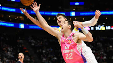 SALT LAKE CITY, UTAH - OCTOBER 16: Dane Pineau #22 of the New Zealand Breaker leaps for the ball with Walker Kessler #24 of the Utah Jazz during the first half of a preseason game at Delta Center on October 16, 2023 in Salt Lake City, Utah. NOTE TO USER: User expressly acknowledges and agrees that, by downloading and or using this photograph, User is consenting to the terms and conditions of the Getty Images License Agreement. (Photo by Alex Goodlett/Getty Images)