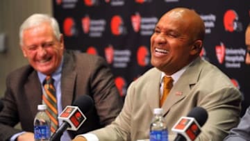 Jan 13, 2016; Berea, OH, USA; Cleveland Browns owner Jimmy Haslam (left) and new head coach Hue Jackson talk during a press conference at the Cleveland Browns training facility. Mandatory Credit: Ken Blaze-USA TODAY Sports
