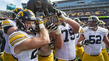 Oct 8, 2016; Minneapolis, MN, USA; Iowa Hawkeyes hold up the Floyd of Rosedale Trophy after defeating the Minnesota Golden Gophers at TCF Bank Stadium. The Hawkeyes won 14-7. Mandatory Credit: Jesse Johnson-USA TODAY Sports