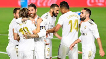 Real Madrid's Spanish defender Sergio Ramos (3L) and teammates celebrate Real Madrid's French forward Karim Benzema's goal during the Spanish league football match between Real Madrid CF and Valencia CF at the Alfredo di Stefano stadium in Valdebebas, on the outskirts of Madrid, on June 18, 2020. (Photo by JAVIER SORIANO / AFP) (Photo by JAVIER SORIANO/AFP via Getty Images)