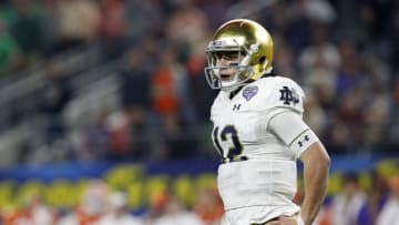 ARLINGTON, TEXAS - DECEMBER 29: Ian Book #12 of the Notre Dame Fighting Irish looks on in the second half against the Clemson Tigers during the College Football Playoff Semifinal Goodyear Cotton Bowl Classic at AT&T Stadium on December 29, 2018 in Arlington, Texas. (Photo by Tim Warner/Getty Images)