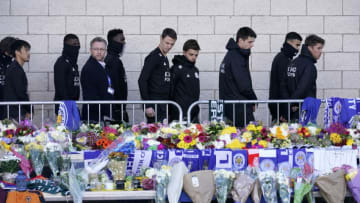LEICESTER, ENGLAND - OCTOBER 29: Leicester City Football Club players pay their respects at the sea of tributes to the victims of the helicopter crash at Leicester City Football Club's King Power Stadium on October 28, 2018 in Leicester, England. The owner of Leicester City Football Club, Club owner Vichai Srivaddhanaprabha, was among the five people who died in the helicopter crash on Saturday evening after the club's game against West Ham. (Photo by Christopher Furlong/Getty Images)