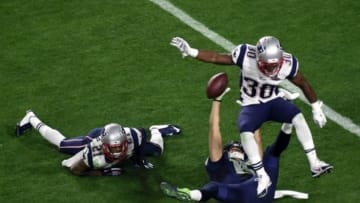 Feb 1, 2015; Glendale, AZ, USA; Seattle Seahawks wide receiver Jermaine Kearse (15) makes a catch against New England Patriots strong safety Duron Harmon (30) and strong safety Malcolm Butler (21) during the fourth quarter in Super Bowl XLIX at University of Phoenix Stadium. Mandatory Credit: Richard Mackson-USA TODAY Sports