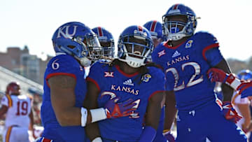 Nov 12, 2016; Lawrence, KS, USA; Kansas Jayhawks running back Tyler Patrick (4) celebrates after rushing for a touchdown against the Iowa State Cyclones during the first half at Memorial Stadium. Mandatory Credit: Peter G. Aiken-USA TODAY Sports
