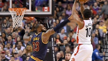 Dec 5, 2016; Toronto, Ontario, CAN; Toronto Raptors guard DeMar DeRozan (10) tries for a three point basket as Cleveland Cavaliers forward LeBron James (23) defends at Air Canada Centre. Cleveland won 116-112. Mandatory Credit: Dan Hamilton-USA TODAY Sports