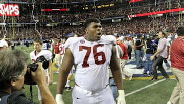 Dec 1, 2012; Atlanta, GA, USA; Alabama Crimson Tide offensive linesman D.J. Fluker (76) celebrates winning the 2012 SEC Championship game against the Georgia Bulldogs at the Georgia Dome. Alabama won 32-28. Mandatory Credit: Daniel Shirey-USA TODAY Sports