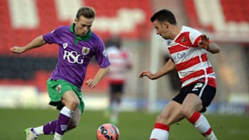DONCASTER, ENGLAND - JANUARY 03: Enda Stevens (R) of Doncaster Rovers challenges Todd Kane of Bristol City during the FA Cup Third Round match between Doncaster Rovers and Bristol City at Keepmoat Stadium on January 3, 2015 in Doncaster, England. (Photo by Nigel Roddis/Getty Images)