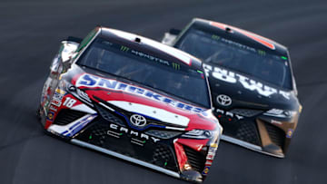 SPARTA, KENTUCKY - JULY 08: Kyle Busch, driver of the #18 Snickers Toyota, leads Martin Truex Jr., driver of the #78 Furniture Row/Denver Mattress Toyota, during the Monster Energy NASCAR Cup Series Quaker State 400 presented by Advance Auto Parts at Kentucky Speedway on July 8, 2017 in Sparta, Kentucky. (Photo by Brian Lawdermilk/Getty Images)