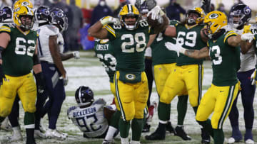 GREEN BAY, WISCONSIN - DECEMBER 27: A.J. Dillon #28 of the Green Bay Packers celebrates a touchdown against the Tennessee Titans during the fourth quarter at Lambeau Field on December 27, 2020 in Green Bay, Wisconsin. (Photo by Dylan Buell/Getty Images)