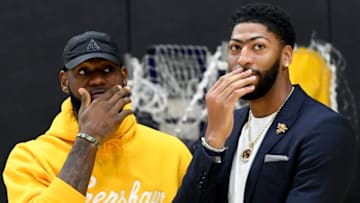 EL SEGUNDO, CALIFORNIA - JULY 13: Anthony Davis (R) talks with LeBron James as Davis is introduced as the newest player of the Los Angeles Lakers during a press conference at UCLA Health Training Center on July 13, 2019 in El Segundo, California. NOTE TO USER: User expressly acknowledges and agrees that, by downloading and/or using this Photograph, user is consenting to the terms and conditions of the Getty Images License Agreement. (Photo by Kevork Djansezian/Getty Images)