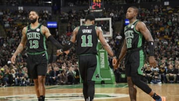 BOSTON, MA - MARCH 24: Marcus Morris #13 Kyrie Irving #11 and Terry Rozier #12 of the Boston Celtics high five against the San Antonio Spurs on March 24, 2019 at the TD Garden in Boston, Massachusetts. NOTE TO USER: User expressly acknowledges and agrees that, by downloading and or using this photograph, User is consenting to the terms and conditions of the Getty Images License Agreement. Mandatory Copyright Notice: Copyright 2019 NBAE (Photo by Brian Babineau/NBAE via Getty Images)