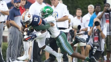 AUBURN, AL - SEPTEMBER 07: Cornerback Thakarius Keyes #26 of the Tulane Green Wave looks to tackle wide receiver Eli Stove #12 of the Auburn Tigers at Jordan-Hare Stadium on September 7, 2019 in Auburn, Alabama. (Photo by Michael Chang/Getty Images)