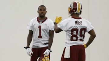May 29, 2014; Ashburn, VA, USA; Washington Redskins wide receiver DeSean Jackson (1) talks with Redskins wide receiver Santana Moss (89) during organized team activities at Redskins Park. Mandatory Credit: Geoff Burke-USA TODAY Sports